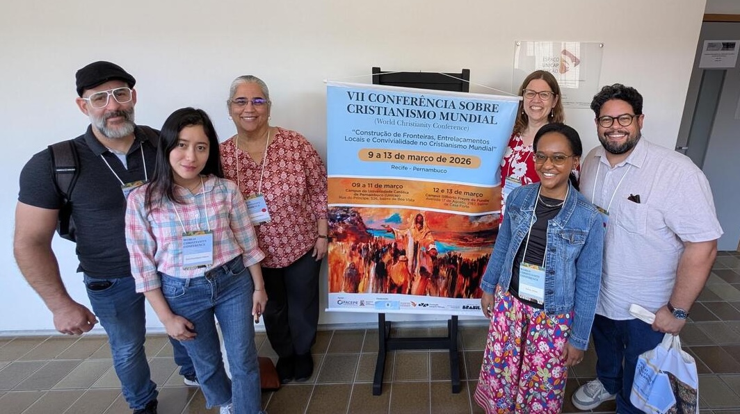 Church music faculty, students, and alumni with the World Christianity Conference welcome sign
