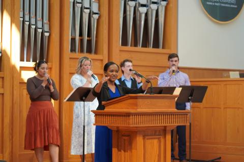 Sylvia leads worship at the CCMS Board Meeting